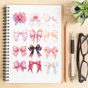 Detailed view of colorful bow-knot stickers in cartoon INS style on a notebook page