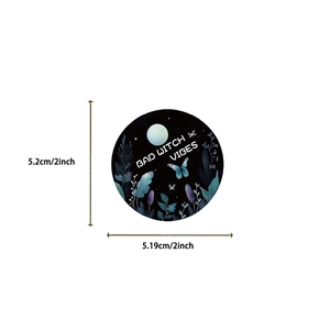 Close-up of a 2-inch Bad Witch Vibes sticker with blue butterflies and moon design