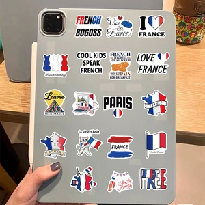 Détail d'autocollants graffiti français sur une tablette avec motifs tour Eiffel