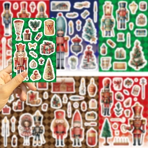 Close-up of Nutcracker Christmas stickers with festive soldiers and trees for scrapbooking