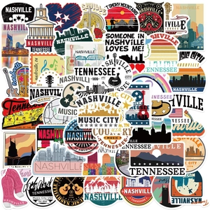 Close-up of Nashville Tennessee vinyl stickers featuring country music and guitar motifs