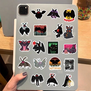 Hand holding tablet with multiple Mothman cartoon stickers including Free Hugs design