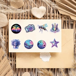 Close-up of holographic vaporwave stickers featuring UFO and Medusa on vintage background