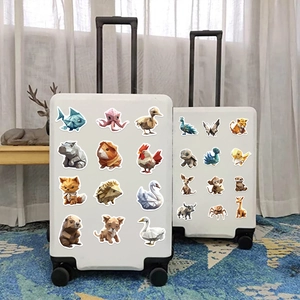 Close-up of geometric origami animal stickers applied to a white suitcase surface