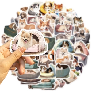 Hand holding a cute Pomeranian dog sticker from a 50-piece pet cartoon collection