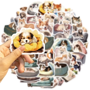 Close-up of a hand holding a cute puppy sticker from a 50pcs cartoon pet set