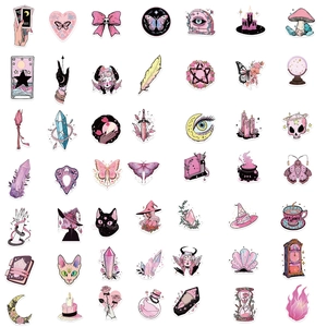 Flat lay of pastel pink and purple witchy vinyl stickers featuring moon and tarot motifs