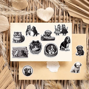Black and white hand-drawn cat and dog stickers on a vintage beige envelope background