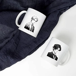 Detail of two white ceramic mugs with black and white manga style male character prints
