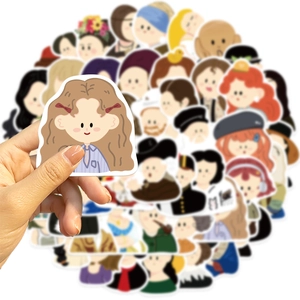 Detail showing various waterproof cartoon art stickers and scale reference by hand