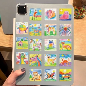 Close-up of colorful waterproof graffiti stickers with animal patterns on a tablet