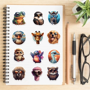 Detailed view of colorful cartoon animal stickers with sunglasses on a notebook
