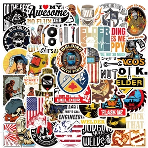Detail of waterproof PVC welding stickers featuring welder slogans and industrial graphics