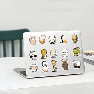 Cute cartoon animal stickers applied on a silver laptop lid for DIY decoration