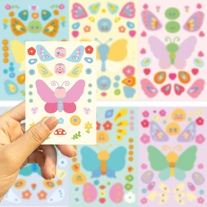 Close-up of pink butterfly stickers and cute cartoon elements for DIY decoration