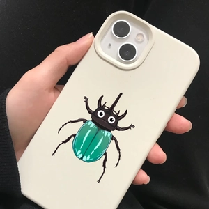 Close-up of a cream-colored iPhone case featuring a cute cartoon beetle illustration