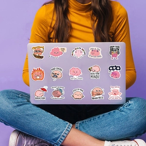 Vibrant cartoon brain stickers on a purple laptop with mental health quotes and humor
