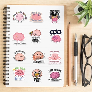 Waterproof brain doodle stickers with mental health quotes on a white spiral notebook