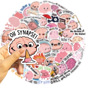 Close-up of waterproof pink cartoon brain stickers with fun puns on a laptop