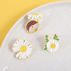 Cartoon daisy hedgehog enamel brooch set with vibrant floral motifs in a ceramic tray