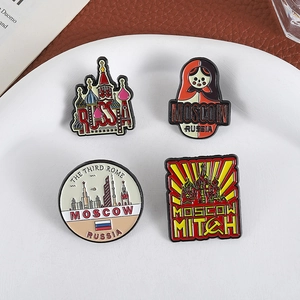 Set of four Russian themed enamel pins featuring matryoshka and St. Basil Cathedral