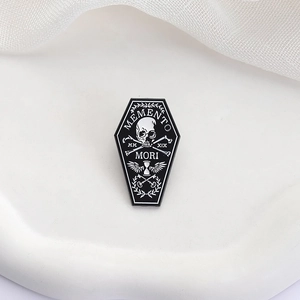 Gothic coffin enamel pin with Memento Mori skull and winged hourglass design