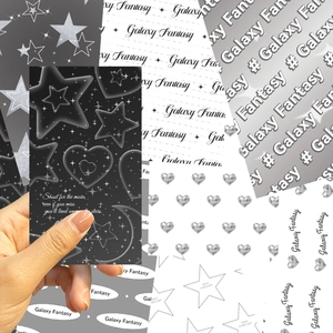 Detail of Galaxy Fantasy DIY phone back cards with monochrome star and moon patterns