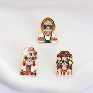 Three colorful Russian style enamel brooches featuring fashionable female characters
