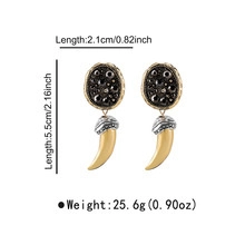 Longues boucles d'oreilles ethniques avec clous ronds noir-or et pendentifs cornes