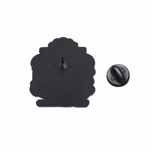 Detail view of the black alloy brooch back with secure rubber clutch and butterfly pin