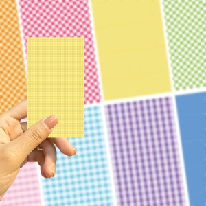 Close-up of colorful grid pattern DIY phone card stickers in yellow and pastel tones