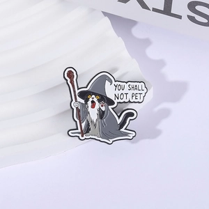 Wizard cat enamel pin with You Shall Not Pet quote on minimalist display stand