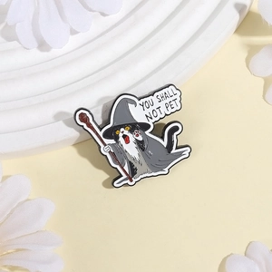 Cartoon black and white cat wizard enamel pin with You Shall Not Pet text quote badge