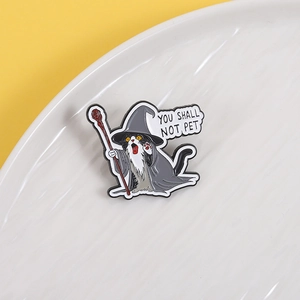 Cartoon black and white cat wizard enamel pin with You Shall Not Pet text quote