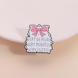 Pink bow enamel pin with Very Demure Very Mindful Very Cutesy quote on cloud frame