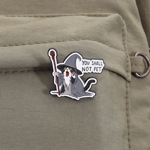 Detail of wizard cat enamel pin with You Shall Not Pet text on khaki canvas bag