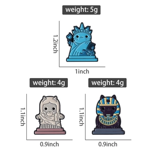 Detailed view of punk mummy and goddess cat enamel pins with size and weight specs