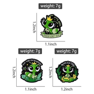 Detailed views of cartoon green mantis enamel pins with crown and floral accents