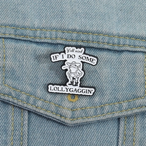 Cartoon frog enamel pin in denim outfit pinned on a light blue denim jacket pocket