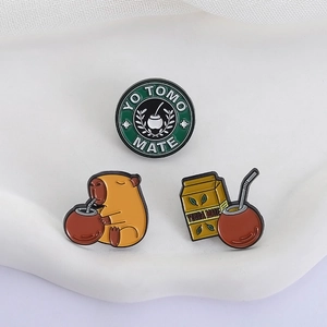 Three-piece metal enamel pin set featuring cute Capybara and Yerba Mate tea designs