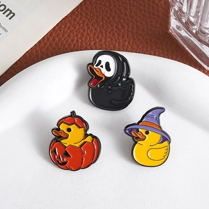 Three-piece Halloween duck enamel pin set featuring ghostface and witch hat themes