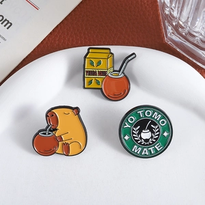 Enamel pins set featuring cartoon capybara drinking mate tea and yerba mate motifs
