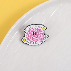 Cartoon enamel pin with Little Miss Procrastinator text on white porcelain plate
