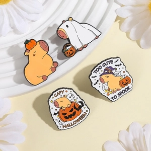 Cute Capybara Halloween enamel pin set with pumpkin and ghost motifs on white tray