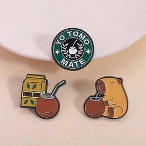 Three-piece enamel pin set featuring cute capybara and Yerba Mate theme for bags
