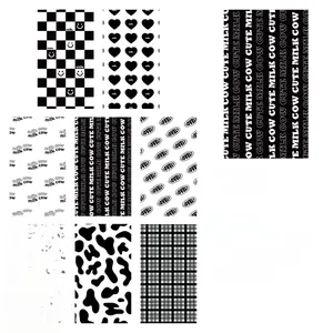 Detail of 8pcs set black and white stickers with cow print and heart patterns