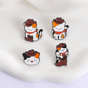 Set of four cute calico cat enamel pins in western cowboy hats and red scarves
