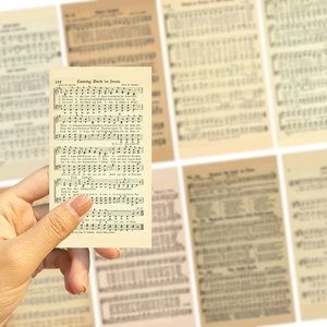 Close-up of vintage sheet music decorative cards with Coming Back to Jesus lyrics
