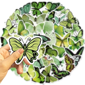 Detailopname van groene vlinderstickers voor DIY-scrapbooking en decoraties