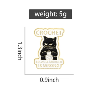 Detail of crochet black cat enamel pin with weight and dimensions on white background